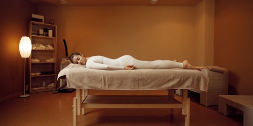 Young Woman In Massage Suit Relaxing On The Table VR6Y5XM